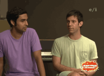 two men are sitting next to each other in front of a cartoon channel logo