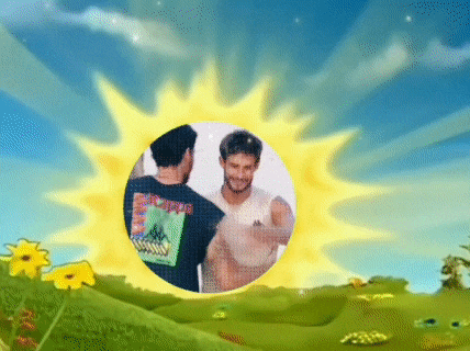two men are standing in a field with a sun behind them