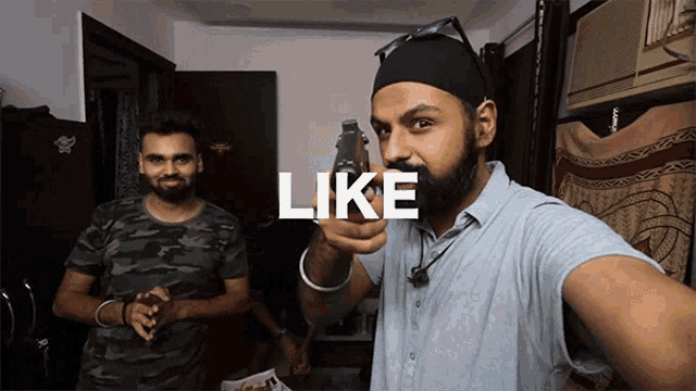 a man pointing a gun at another man with the word like below him
