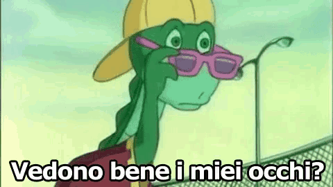 a cartoon turtle wearing sunglasses and a hat is standing next to a street light .