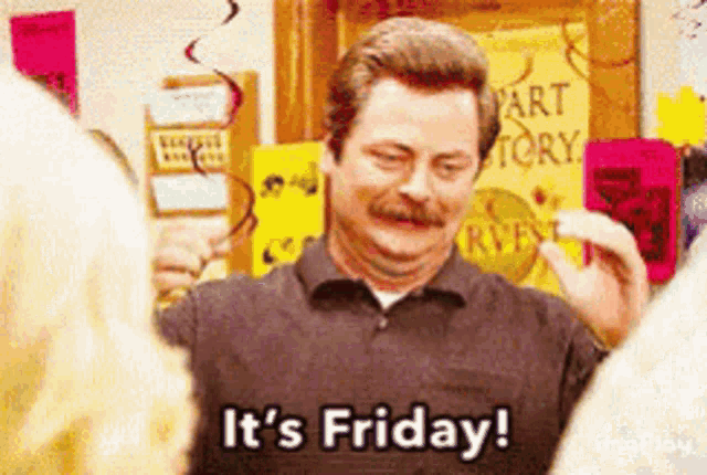 a man says it 's friday in a room