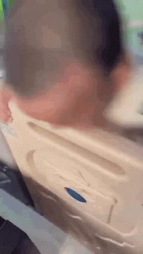 a blurry picture of a person in a hospital bed with the letter l on the side