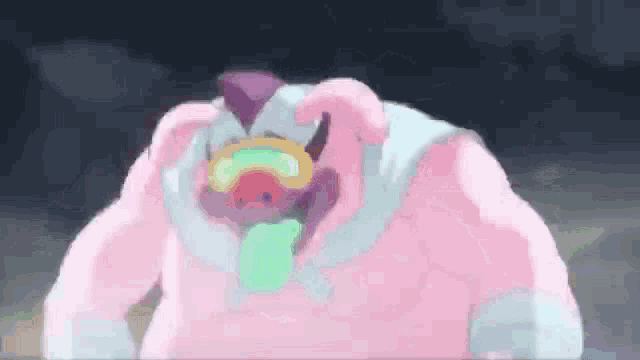 a pink monster with a green tongue sticking out is wearing a pink sweater .