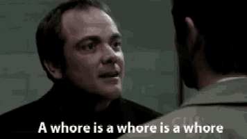 a man talking to another man with the words " a whore is a whore is a whore " below him