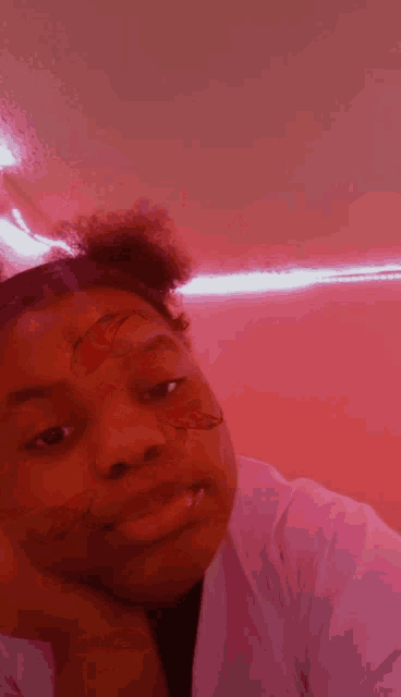 a girl with a butterfly tattoo on her face .