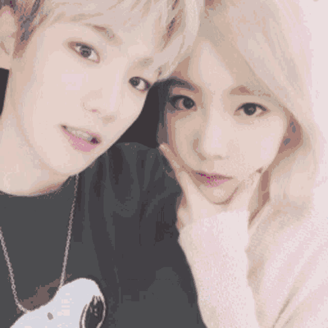 a boy and a girl are posing for a picture with the name baekyeo written on the bottom