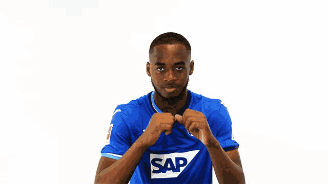 a man in a blue shirt with the word sap on the front