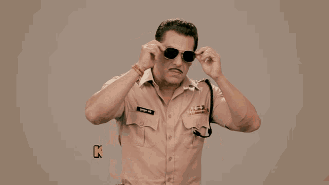 a man in a police uniform with the words kamal karte ho pandey ji on the bottom