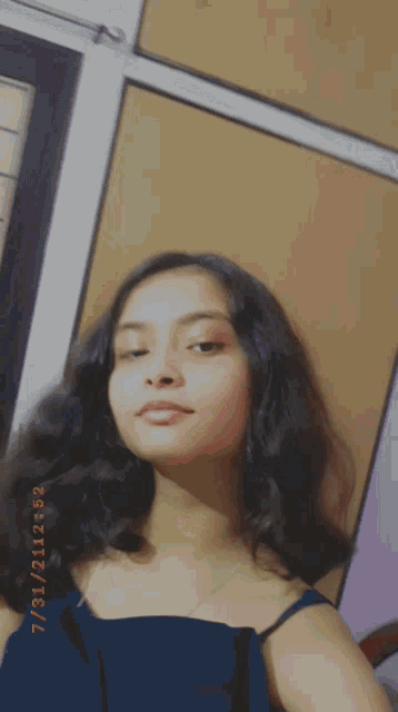 a girl is taking a picture of herself with the date 7/31/21