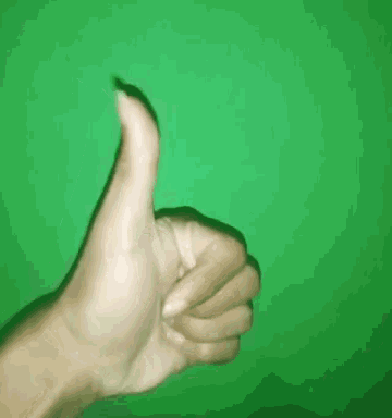 a hand is giving a thumbs up sign against a green background .
