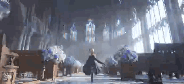 a woman is walking through a church with stained glass windows and flowers .