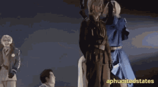 a group of people are standing on a stage with the words apunitedstates on the bottom