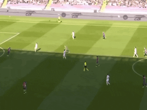 a soccer game is being played on a field with a few players wearing jerseys that say fc barcelona