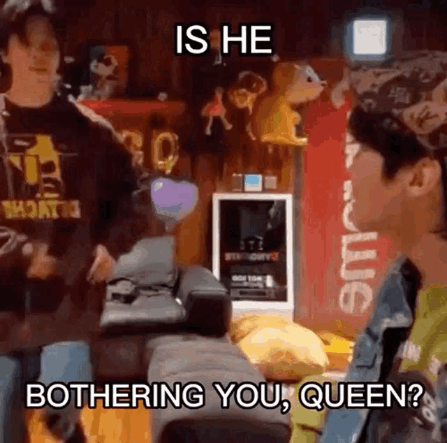 a man is talking to another man in a room and the man is saying is he bothering you queen ?