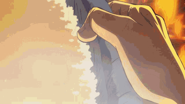 a close up of a person 's hand holding a piece of cloth