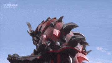 an ultraman official advertisement with a red monster in the background