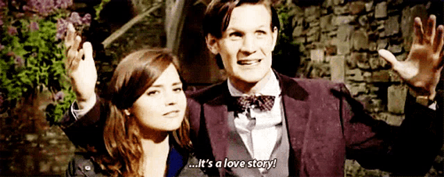 a man and a woman are standing next to each other and the man is saying " it 's a love story "
