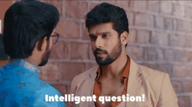 a man with a beard is talking to another man with the words intelligent question written below him