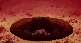 a man is laying in a hole with his head in it