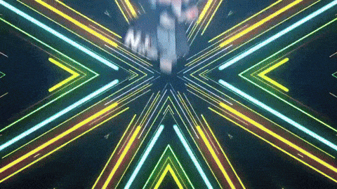 a man in a suit and tie is surrounded by glowing neon lights .
