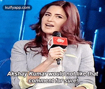 a woman is holding a microphone and says akshay kumar would not like that comment for sure .