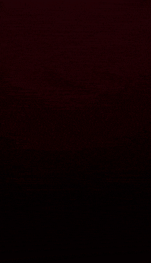 a dark room with red lights shining through the walls