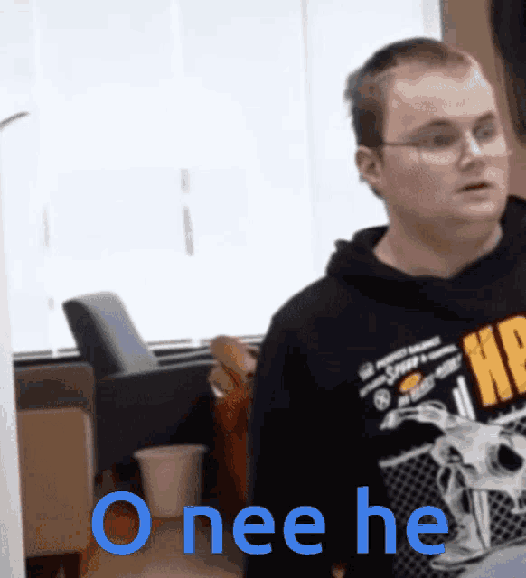 a man wearing a sweatshirt that says " onee he " on it