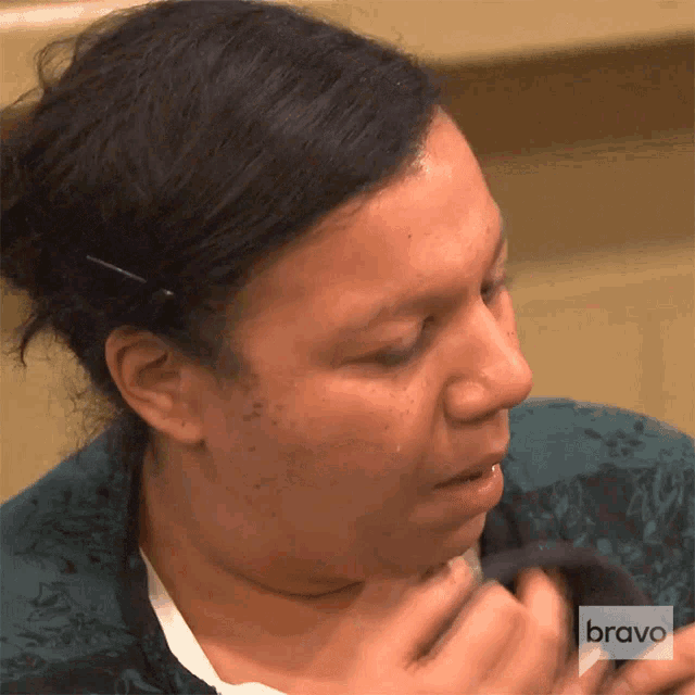 a close up of a woman 's face with bravo written on the bottom right