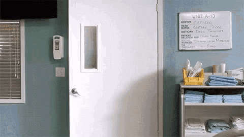 a room with a white board that says unit a-13 on it