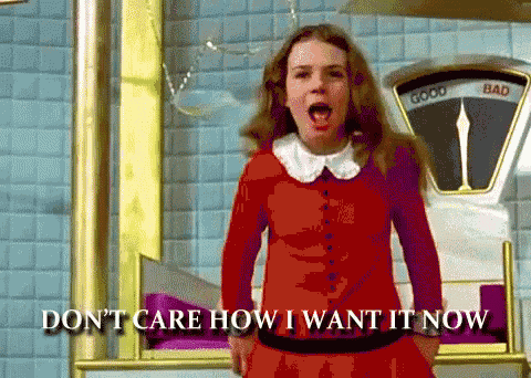a girl in a red dress is standing in front of a scale that says good and bad on it