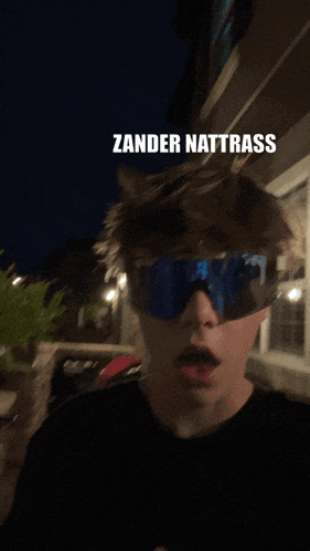 a man wearing sunglasses with the words zander nattrass on the top