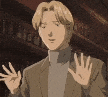 a man in a suit and turtleneck stands in front of a shelf of bottles