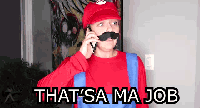 a woman in a mario costume talks on a cell phone