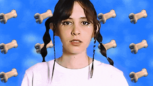 a girl with pigtails stands in front of a blue background with bones on it