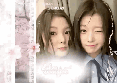 a couple of girls are posing for a picture with the words love of love written in the background