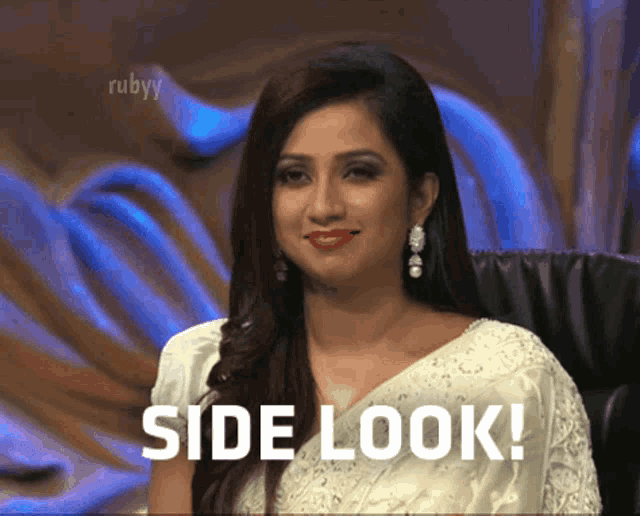 a woman sitting in a chair with the words side look written on the screen