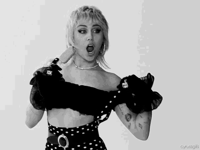 a black and white photo of a woman with the caption cyrusgifs on the bottom right