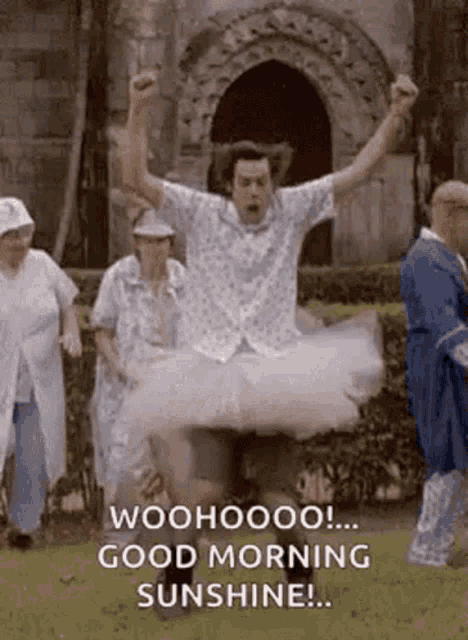 a man in a tutu is jumping in the air with his arms in the air and says good morning sunshine .