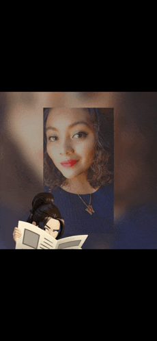 a woman in a blue shirt is reading a book