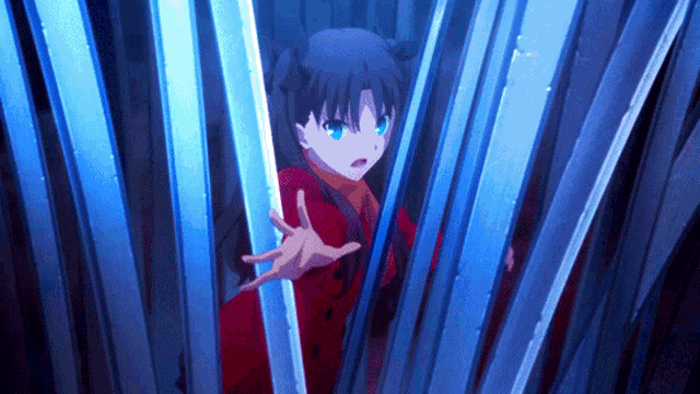 a girl in a red coat is holding a blue object