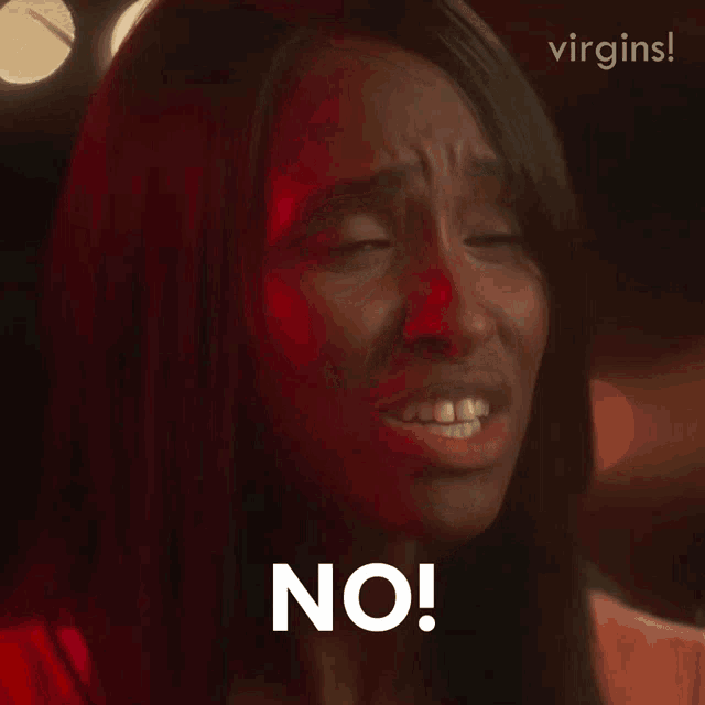 a woman is making a funny face and says " no "