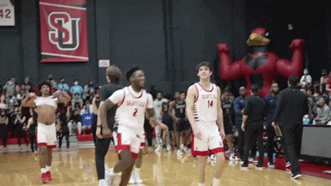a group of basketball players are on a court and one has the number 2 on his jersey