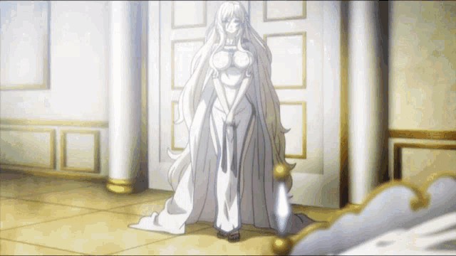 a woman in a white dress stands in a hallway