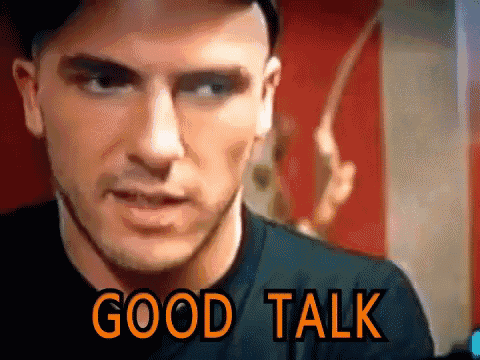 a close up of a man says good talk