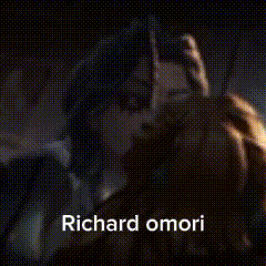 a blurry picture of a person with the name richard omori written on it