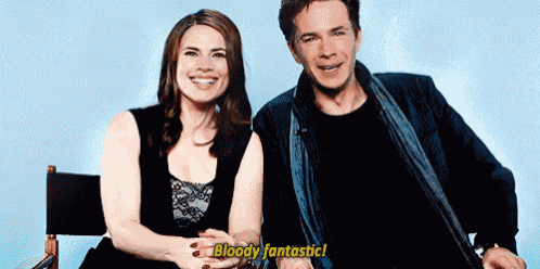 a man and a woman are sitting next to each other and the man is saying bloody fantastic