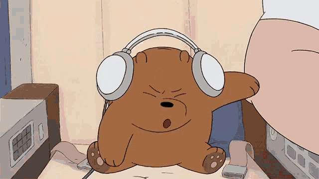 a cartoon bear wearing headphones is sitting on a couch
