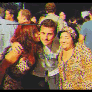 a woman kisses a man on the cheek in a blurry picture