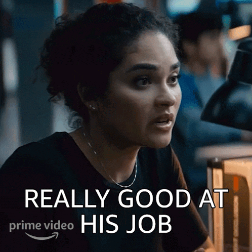 a woman in a black shirt says " really good at his job " in white letters