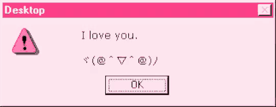 a pink computer screen says i love you and has an ok button